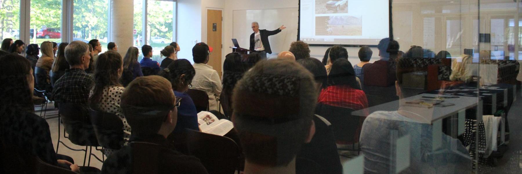 Professor Lenard conducting an alumni lecture