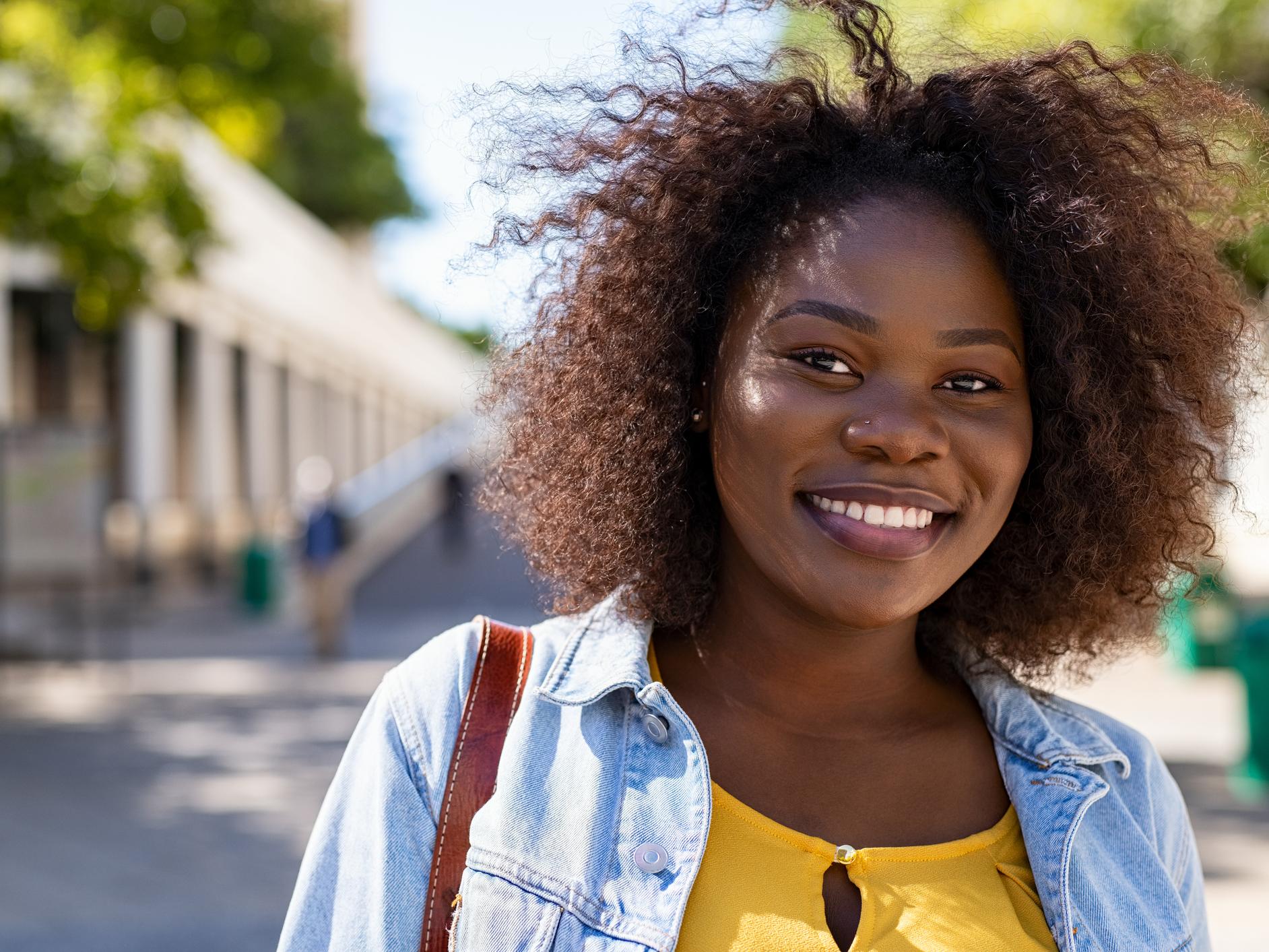 A smiling black female student
