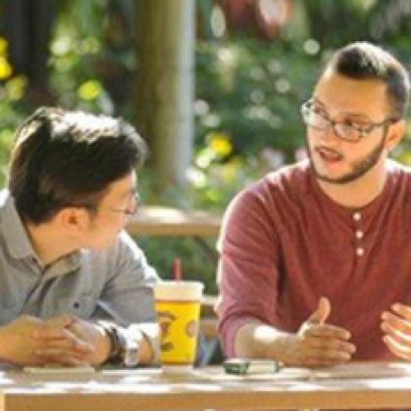 students talking at a table