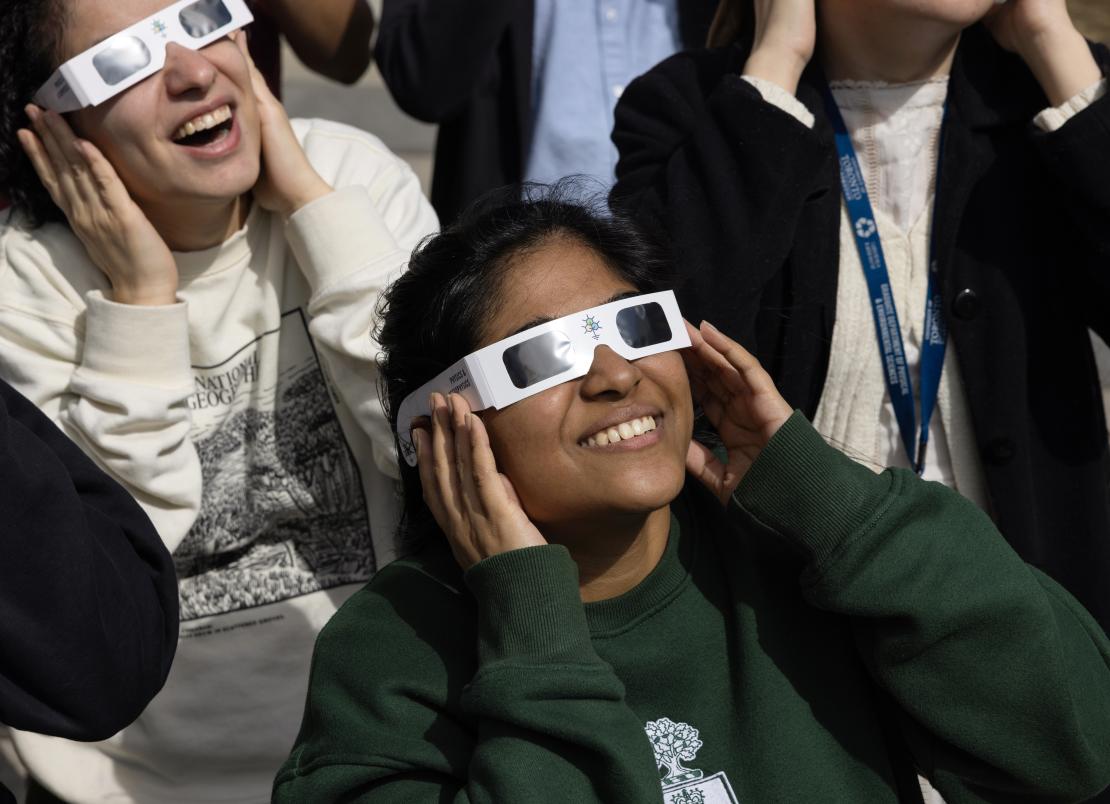 Students watching eclipse with special glasses