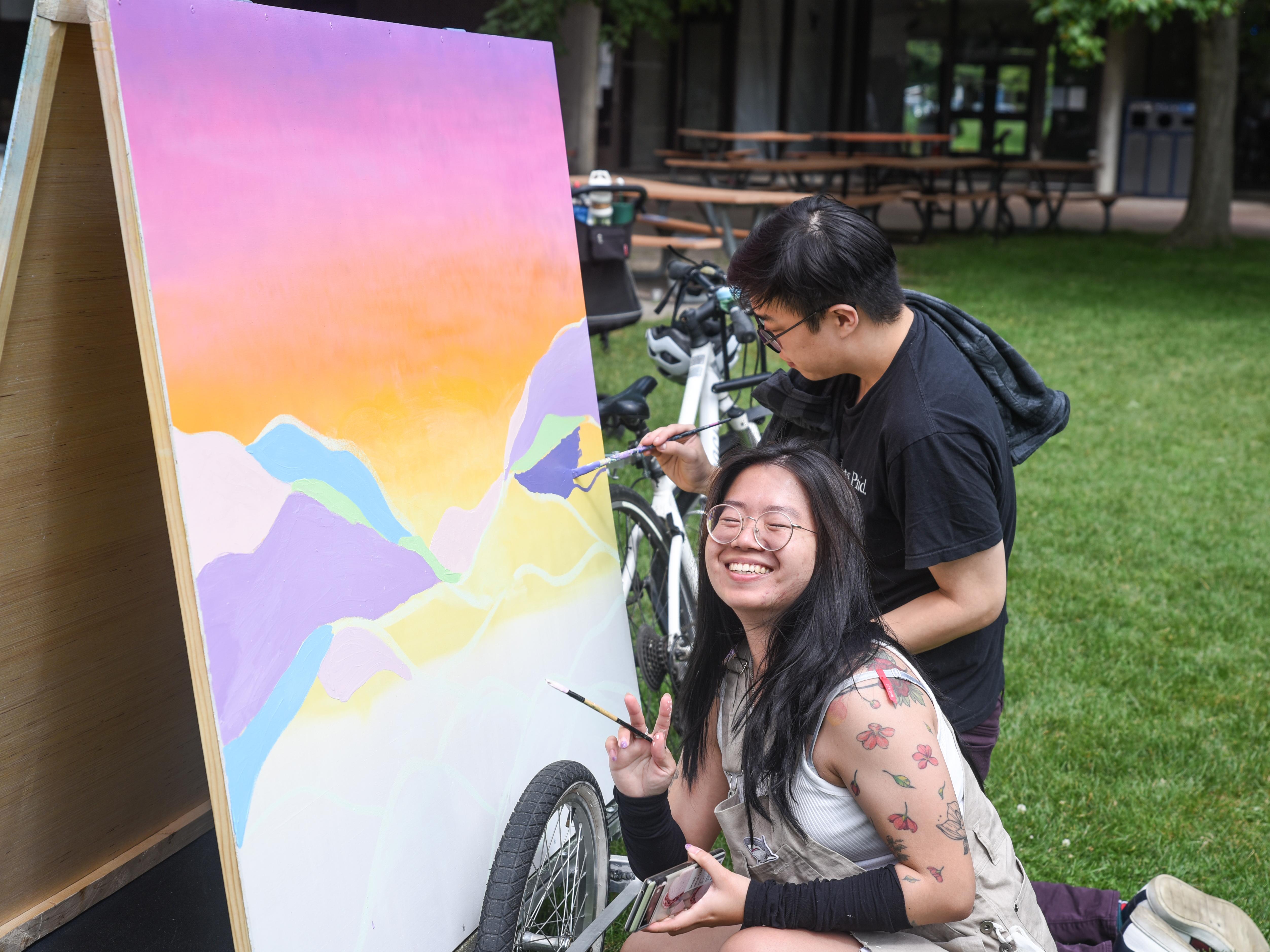 Participants paint Scarbrite Art Cart at UTSC