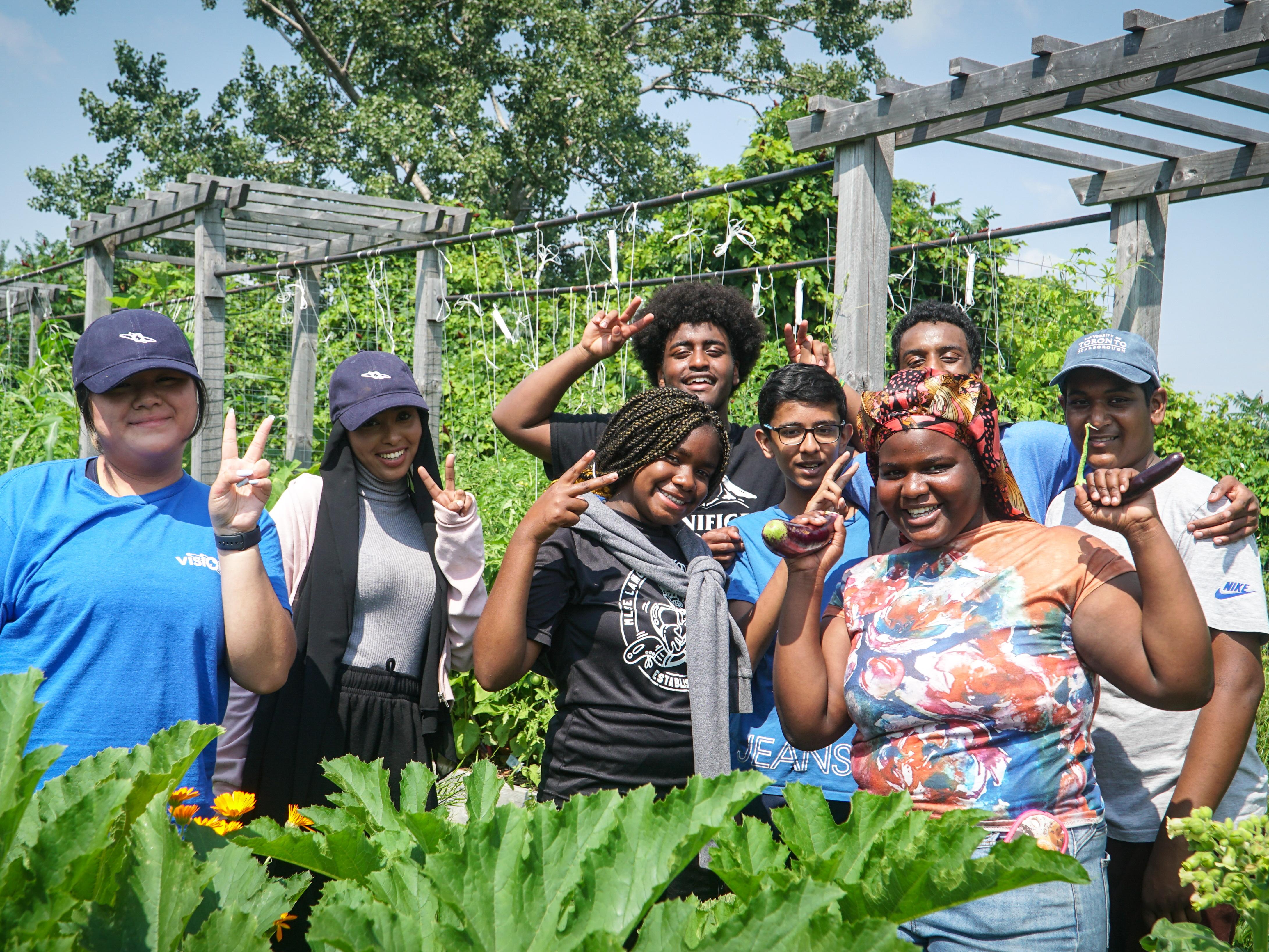 Students from Visions of Science visiting UTSC's Campus Farm   100 Strong Academy program participants 