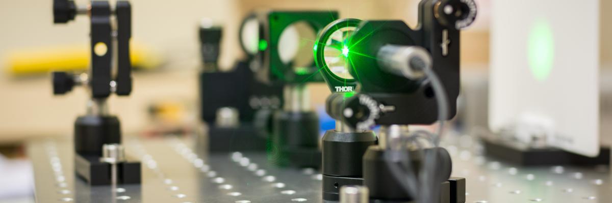 Laser machine displaying green laser