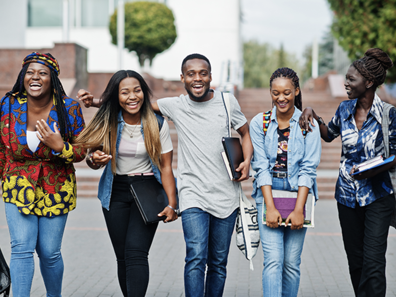 Group of 5 black students smiling together