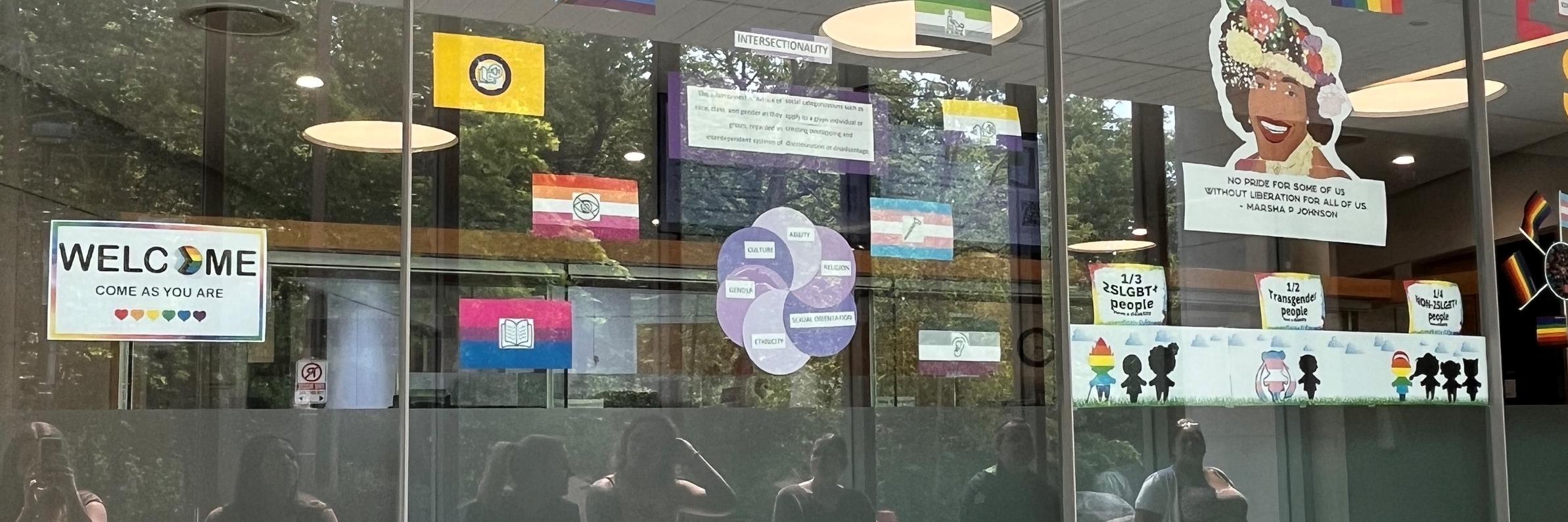 AccessAbility Window display for pride month.  Images recognizing intersectionality - disaiblity and LGBTQ+ identity
