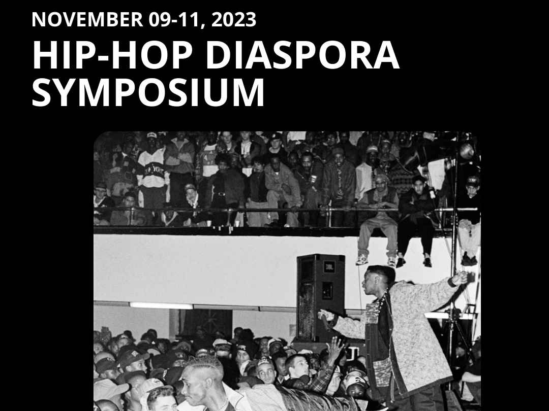 white text Hip-Hop Diaspora Symposium happening on November 9-11, 2023. Black and white image of a music festival below.