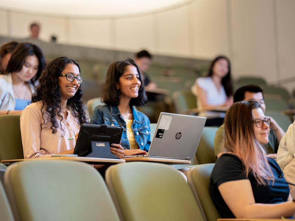 Students in a lecture hall, engaged