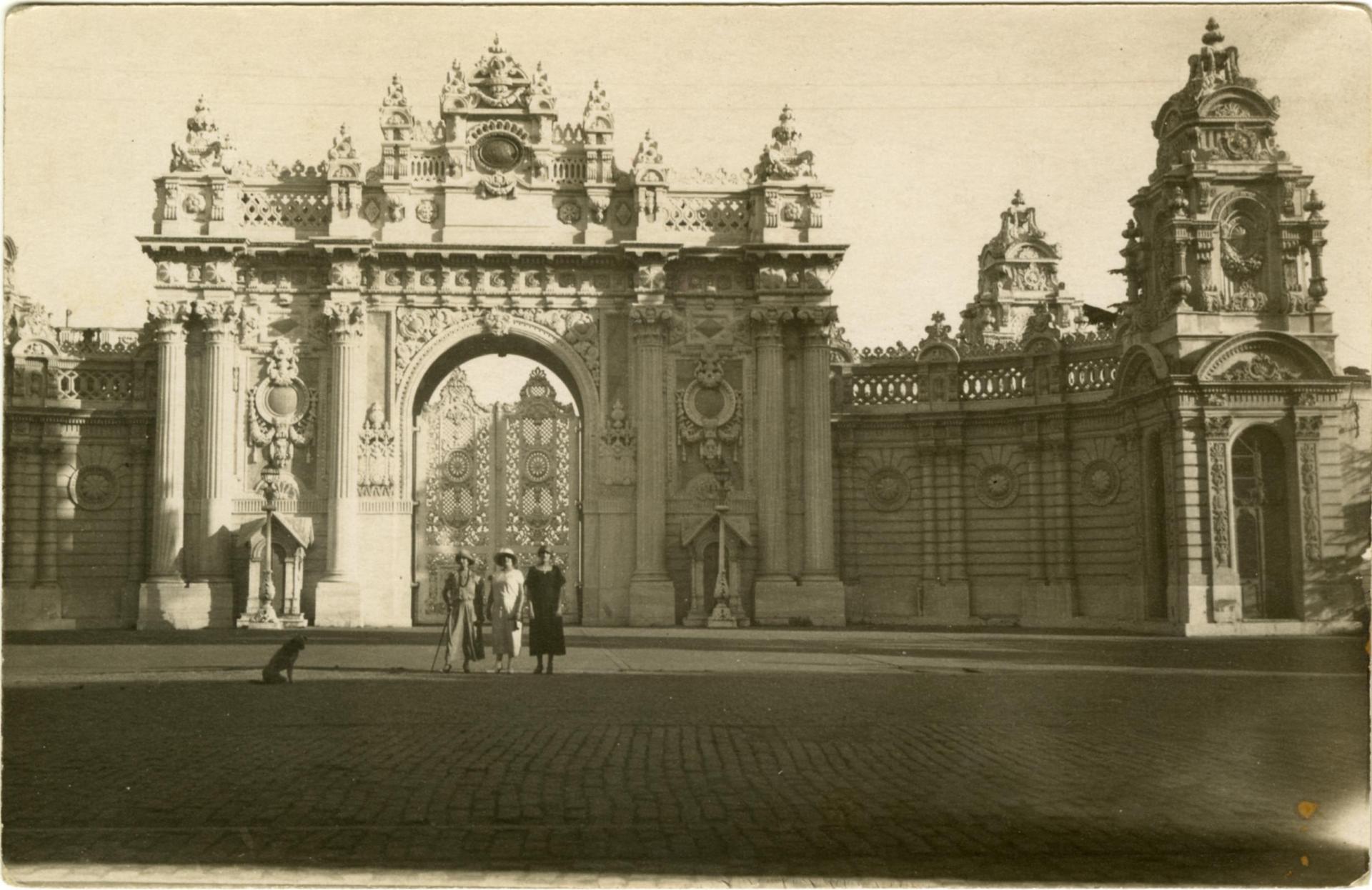 Three women stand before an elaborate gate in Constantinople, circa 1920-30