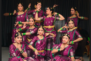 Shilompoli Shethra Dance Academy dancers pose in Tamil costumes