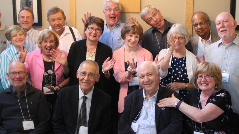group of older UTSC alumni making happy fun faces