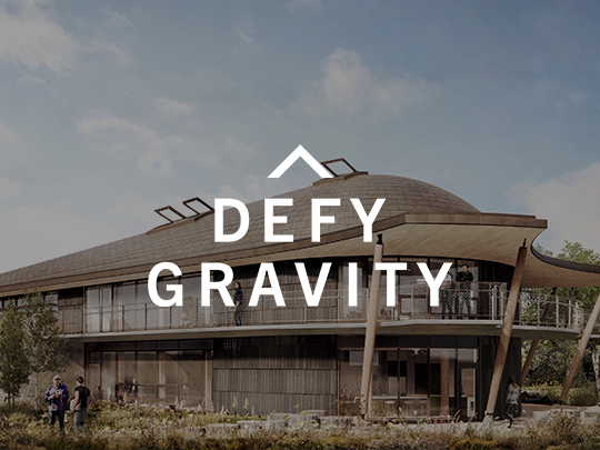 Digital rending of UTSC Indigenous House with the white Defy Gravity logo in the centre