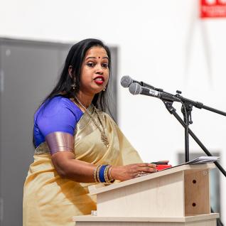 Raveena Rajasingham at the podium