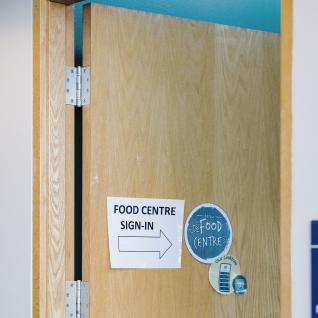 door to the Food Centre with the note, Food Centre sign-ups