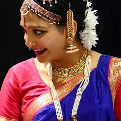 Women in ceremonial Tamil dress during a performance