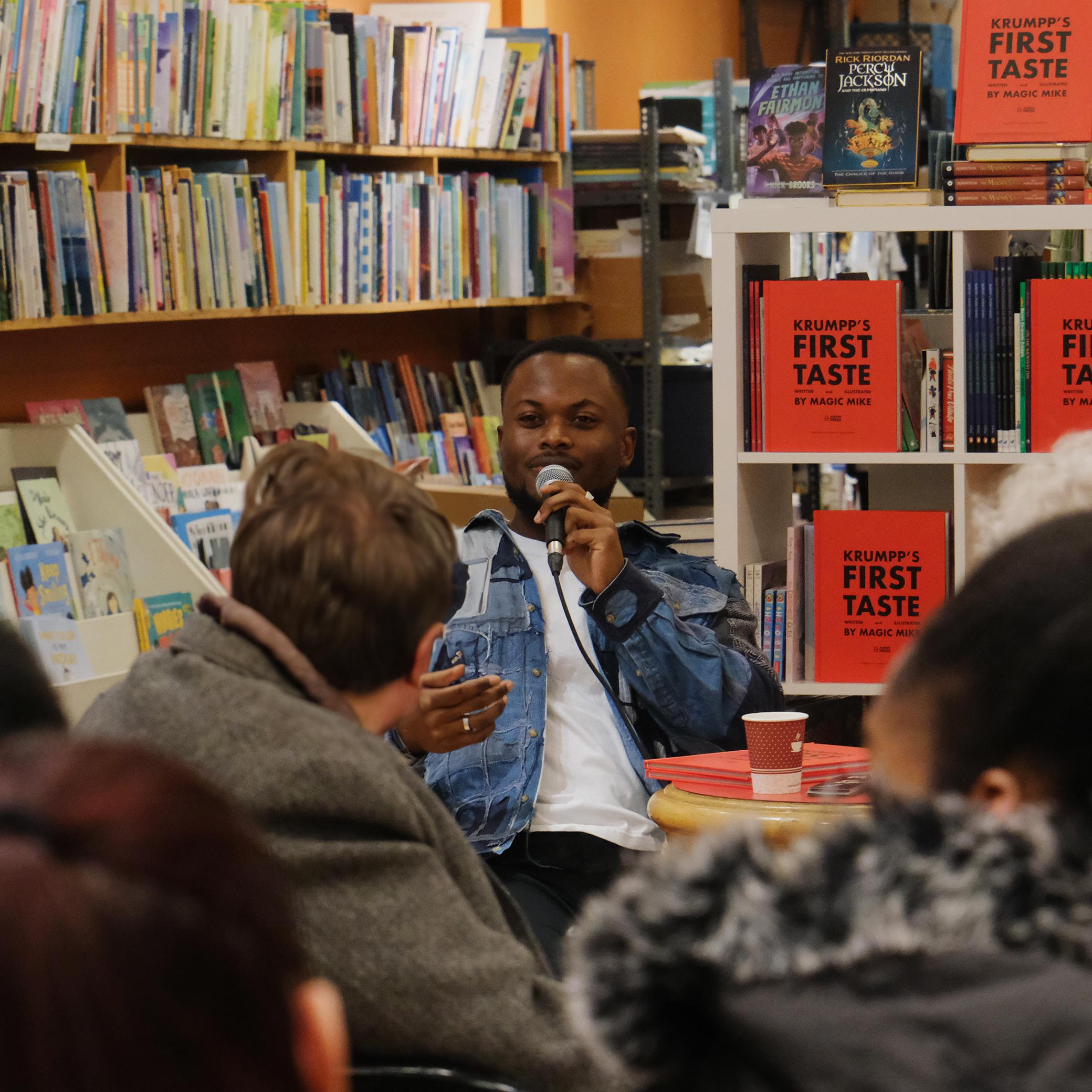 michael addressing a crowd in a library