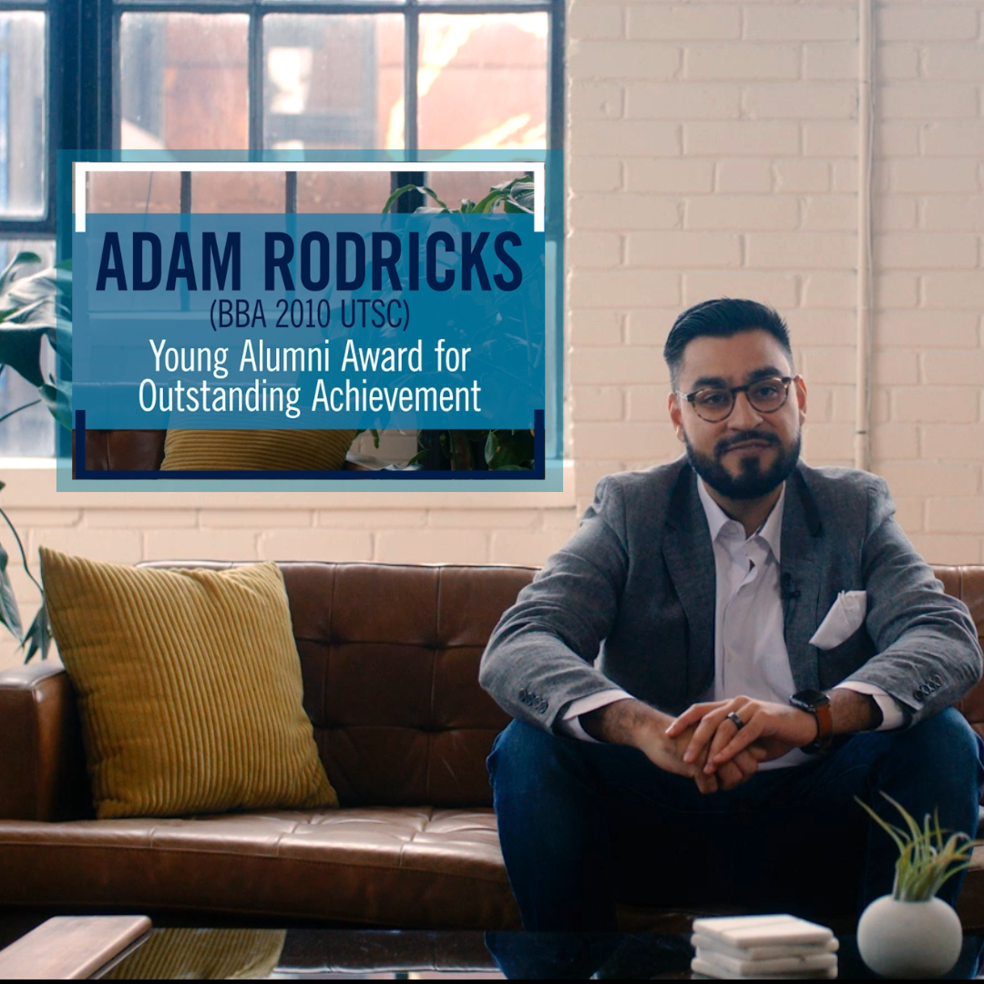 Adam rodricks sitting on a couch