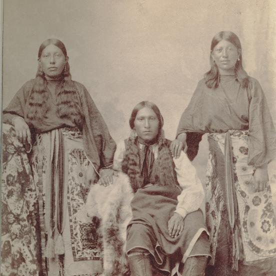 Two Kiowa women and one man in an archive picture from the 1890s