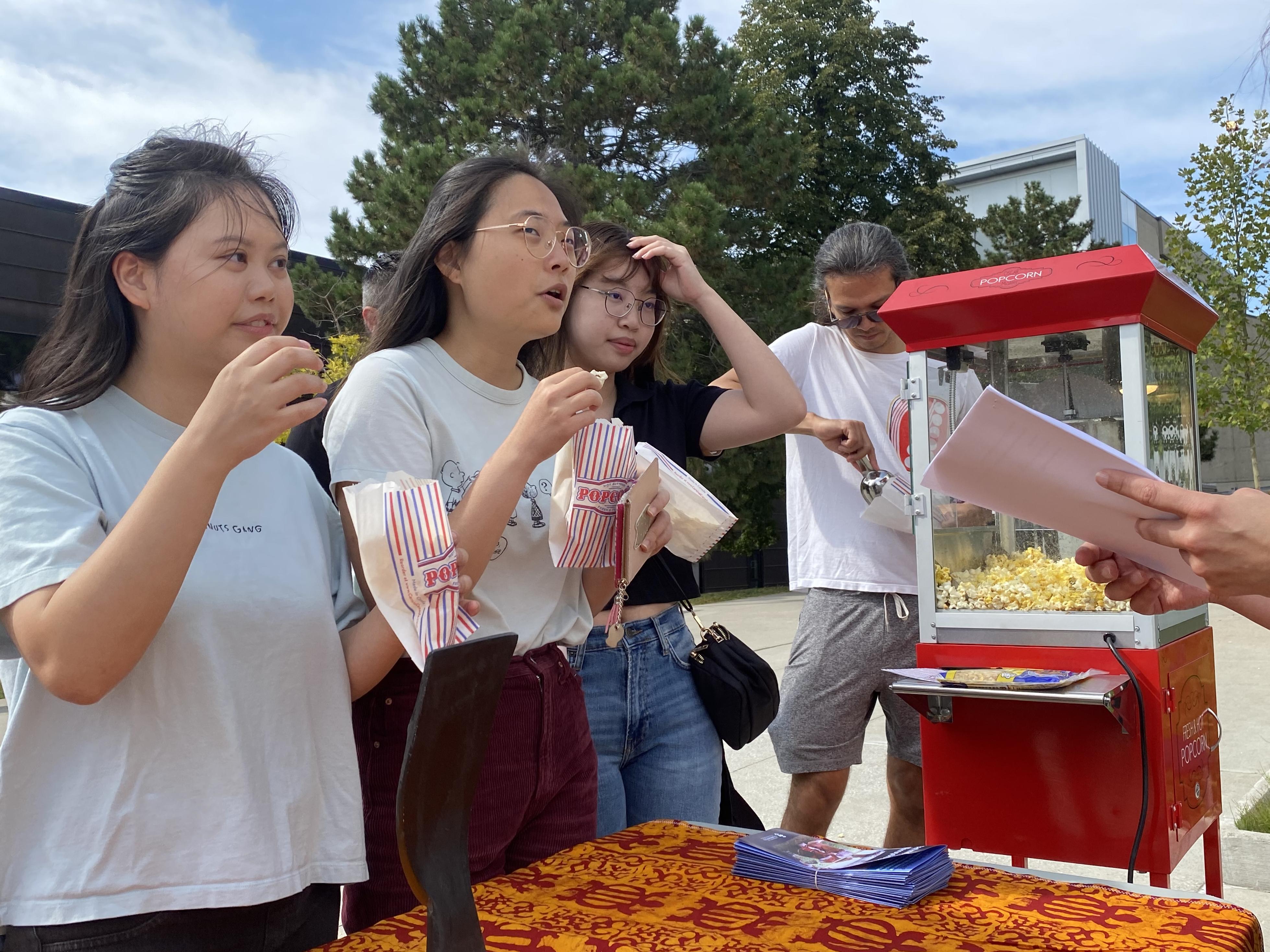 Students eating popcorn