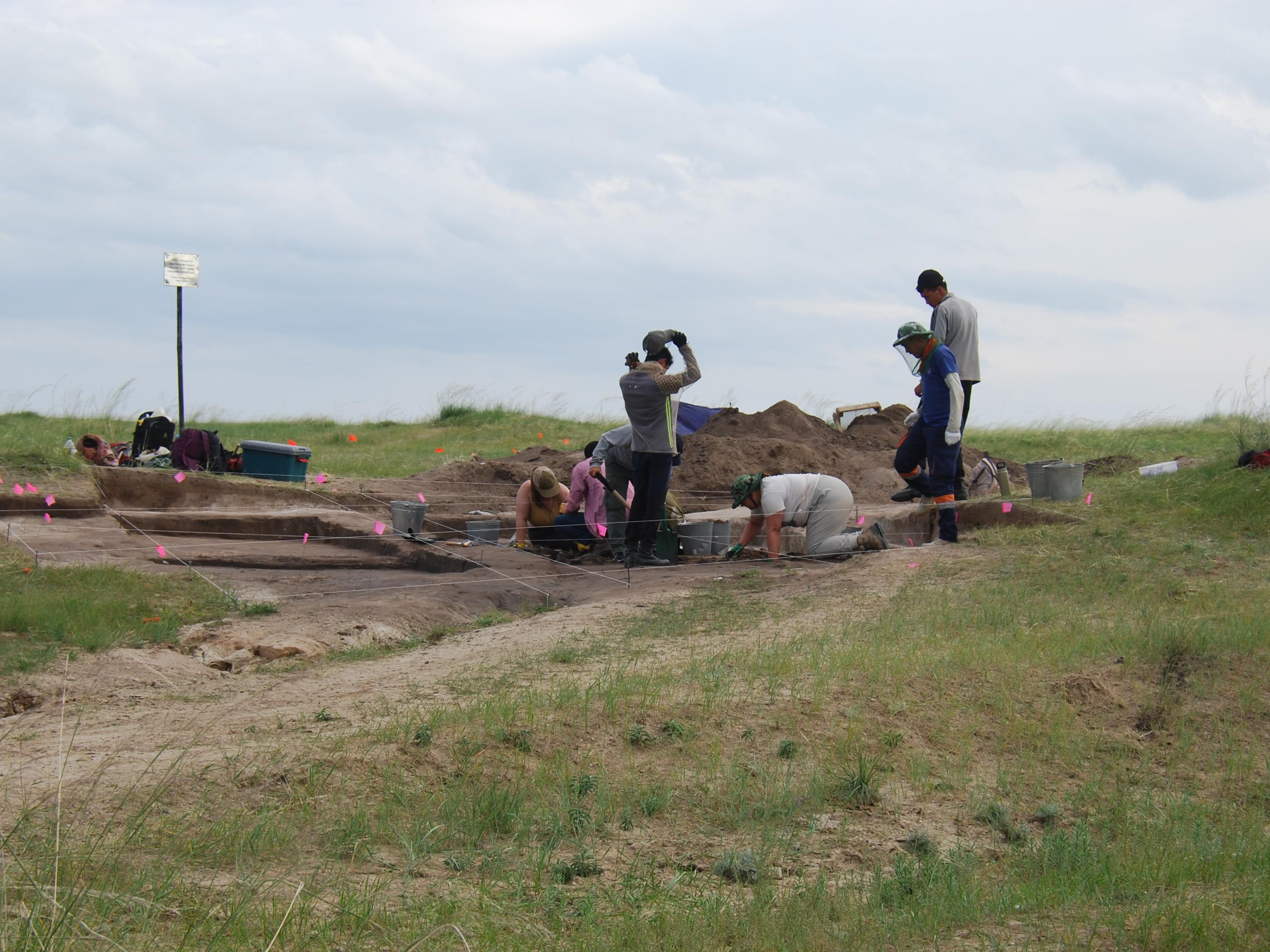 Archaeologists excavating arounda burial site on the Gobi Steppe
