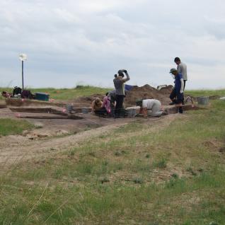 Archaeologists excavating around the burial site.
