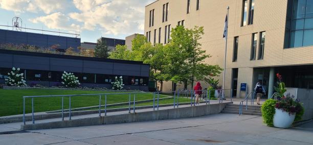 Outside photo of Arts and Administration building with an accessibly designed building ramp