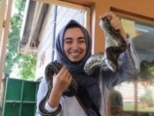 Sana Najafi with a snake