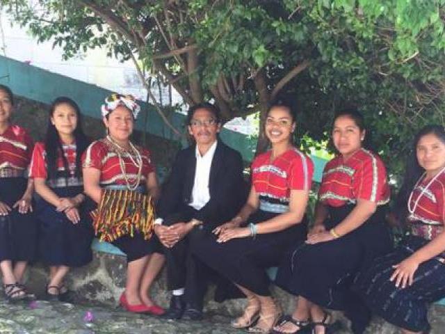 Chantal with her boss and colleagues wearing a 'traje tipico', the traditional cultural outfit of the community