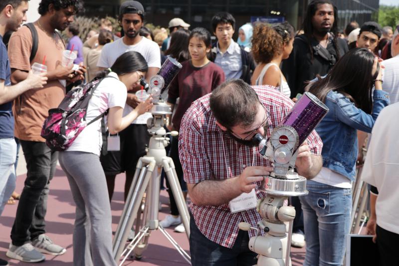 people using telescopes