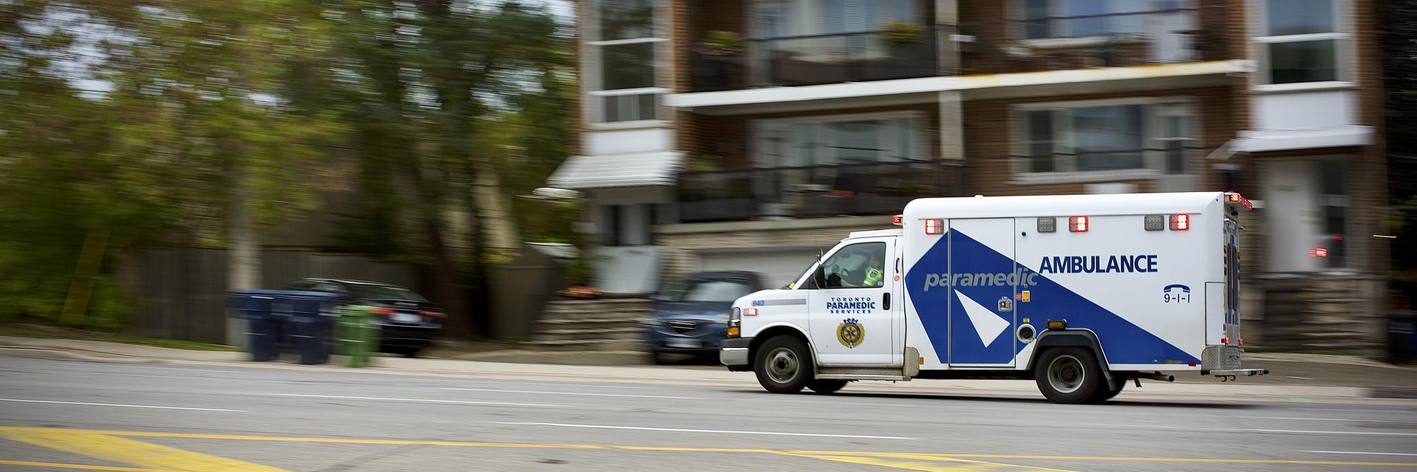 Ambulance driving through Toronto streets