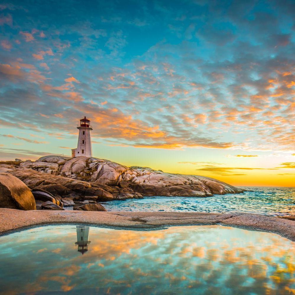 Peggy's Cove lighthouse in Halifax, Nova Scotia during sunset