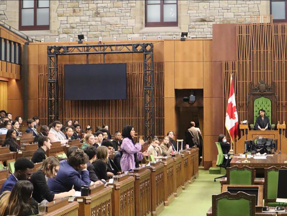 Students participate in model parliament inside the House of Commons