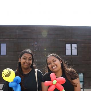 Homecoming participants posed with balloons 