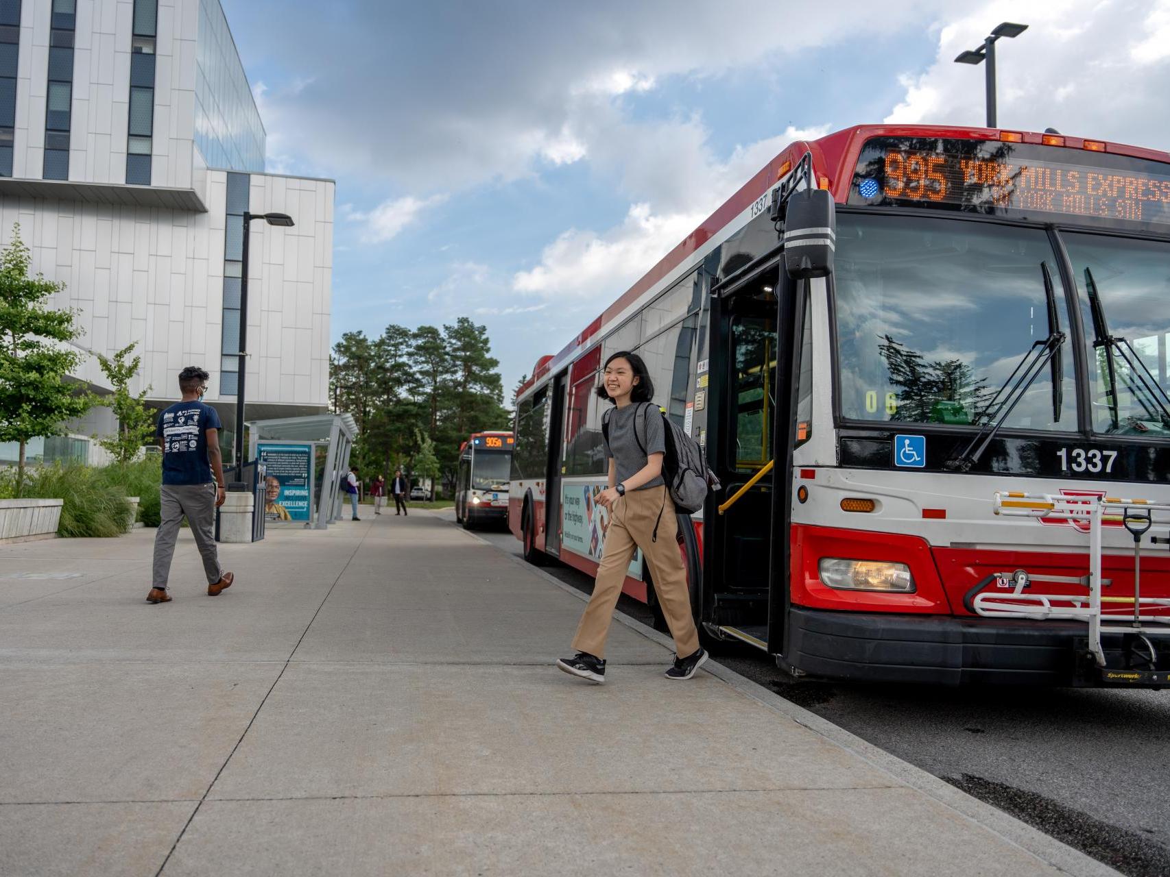 student gets off TTC bus