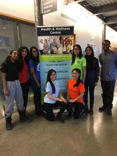 students with a health & wellness centre banner