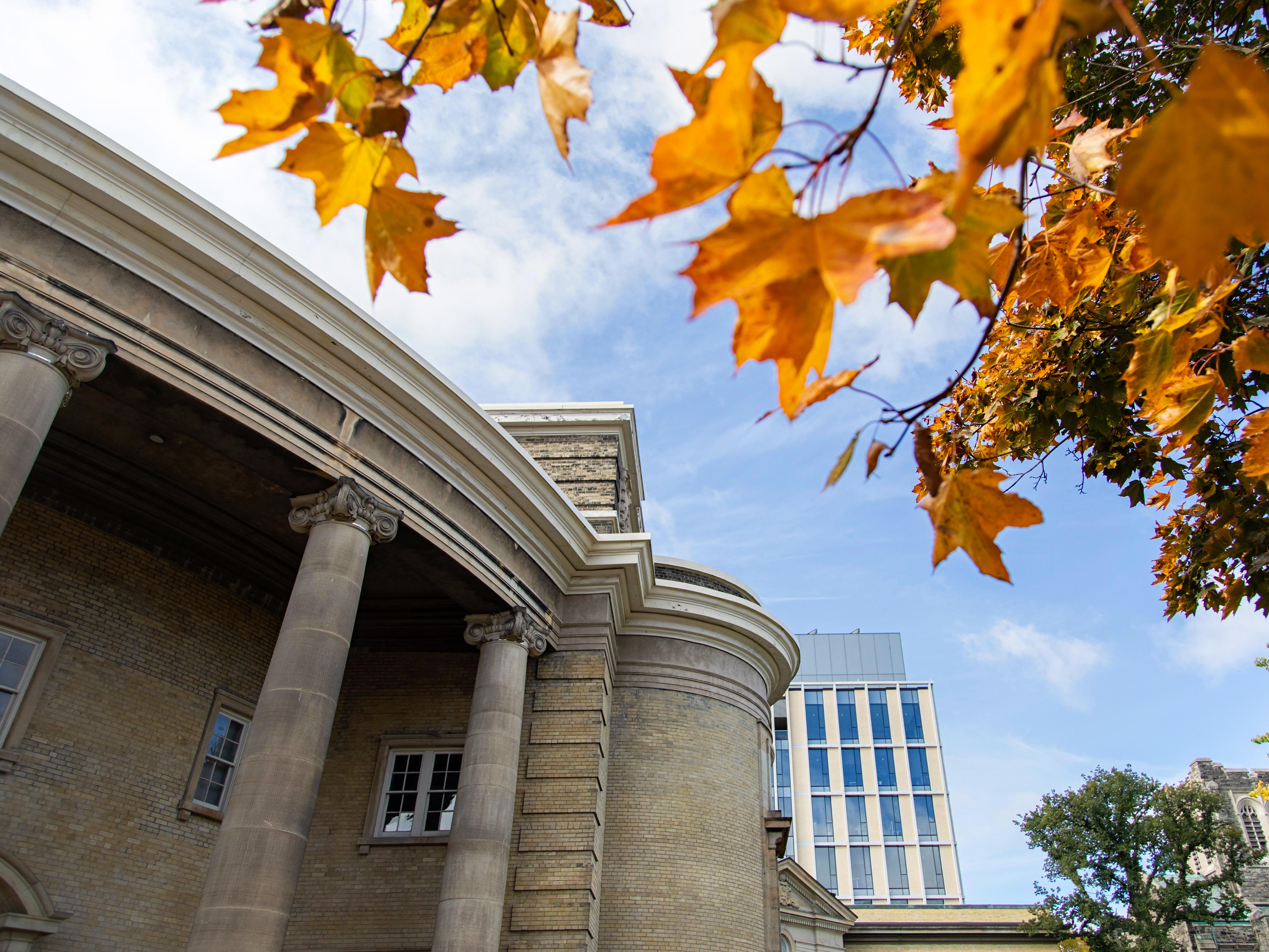 U of T Convocation Hall exterior with fall colours.
