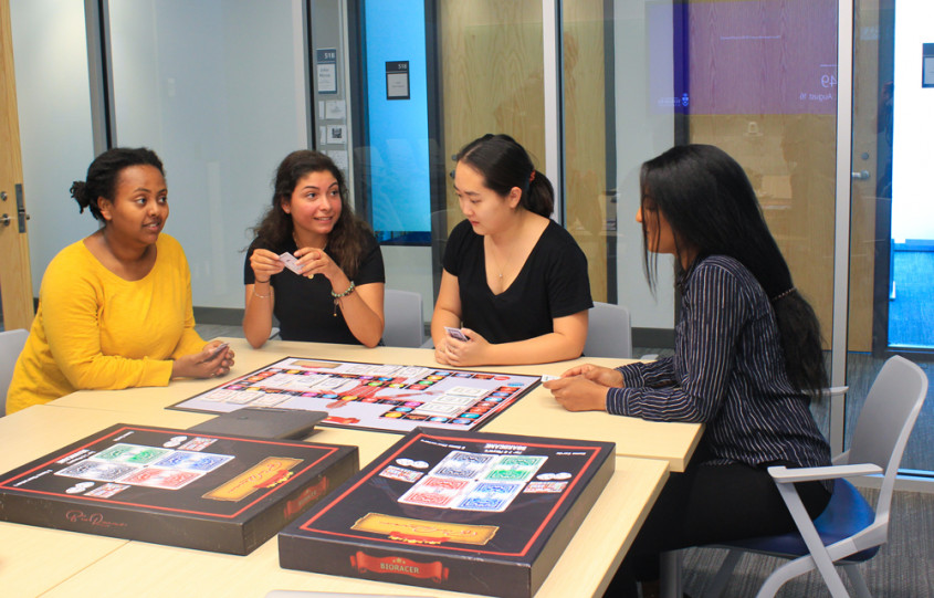 Students playing bioracer board game