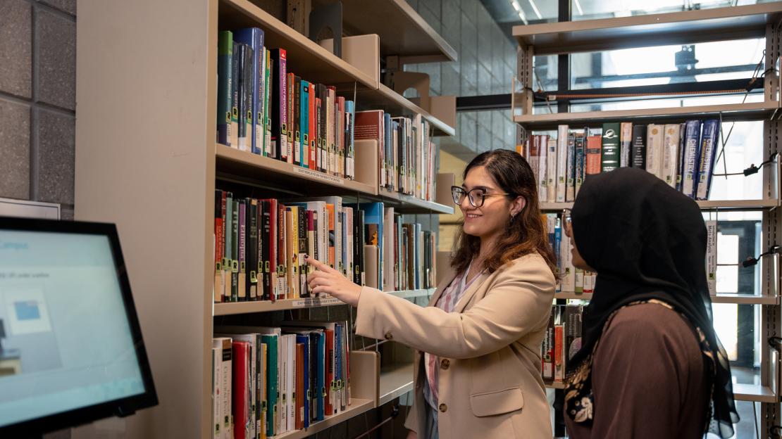 Students in the stacks at the UTSC library 