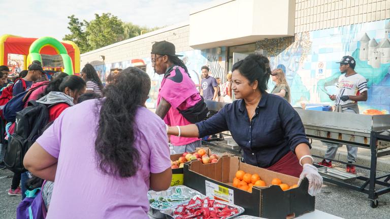 BGCES Volunteers give out food to the community at a back to school event