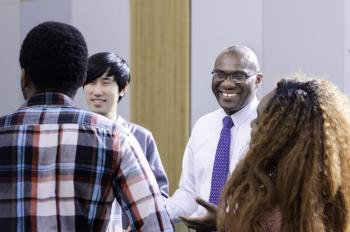 UTSC Principal Wisdom Tettey chatting with students 