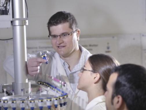 three people in a laboratory