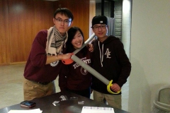 Students celebrating with their foam fencing swords