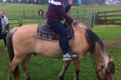 Charles, the Outdoor Recreation Coordinator on a horse