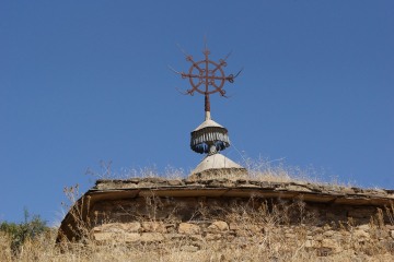 Roof cross and 'bells' surmounting the old built church at May Wayni Giyorgis.