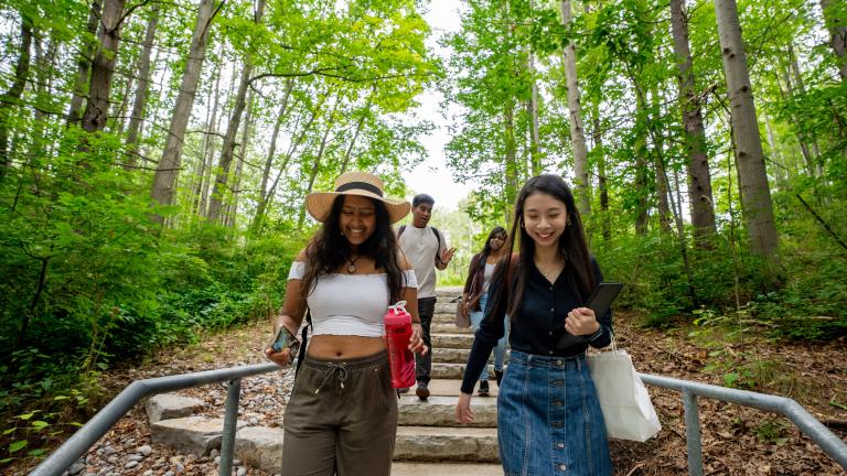 Students walking down the steps to the Ma Moosh Ka Win Valley Trail at U of T Scarborough