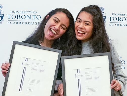 two students winning awards