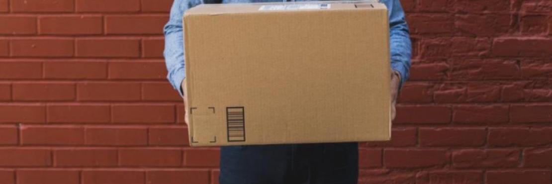 man holding shipping box