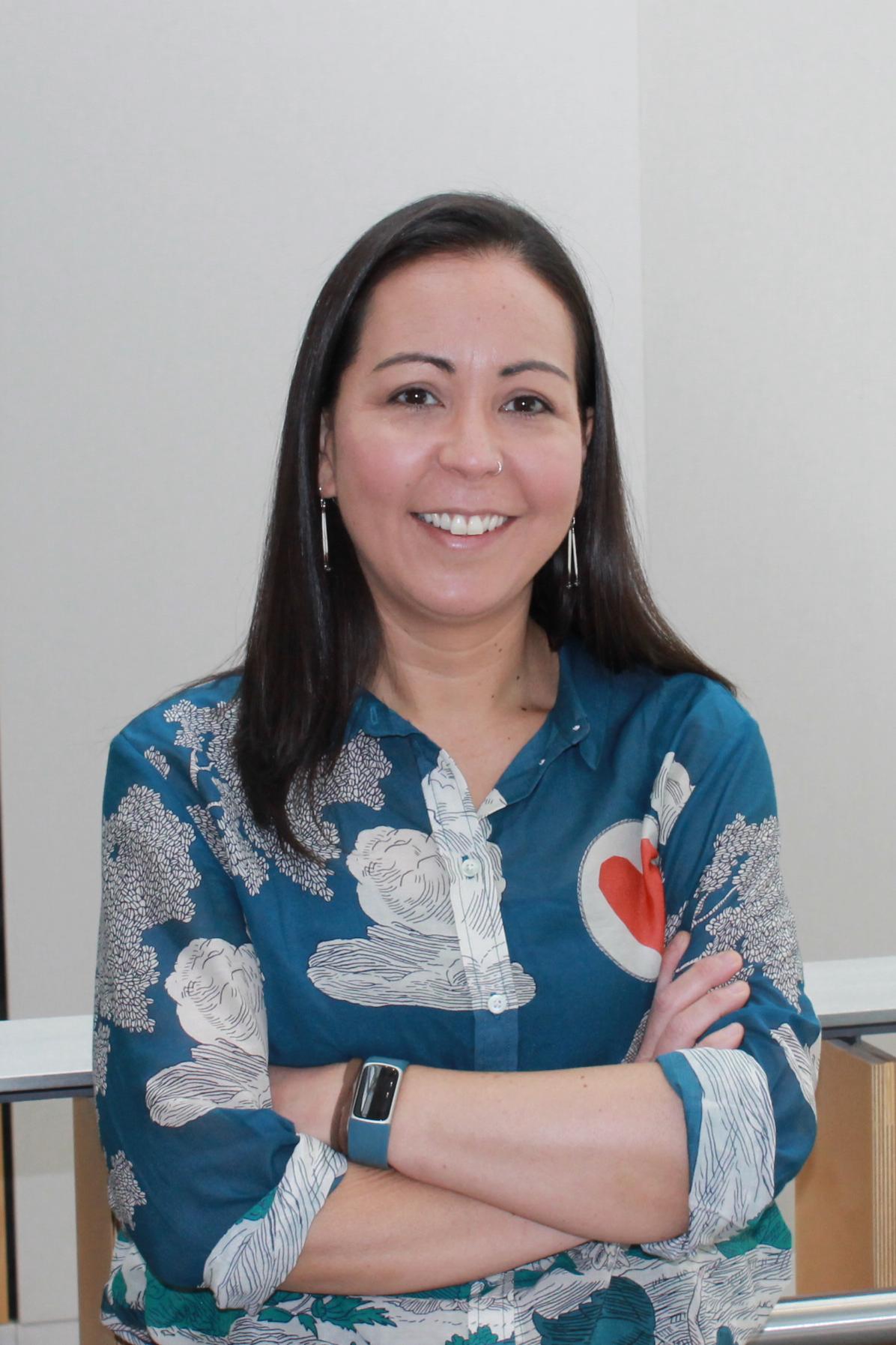 Prof. Dani Kwan-Lafond, a young woman with dark hair wearing a blue shirt