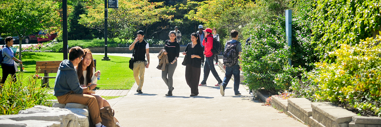 A group of students walking outside UTSC building