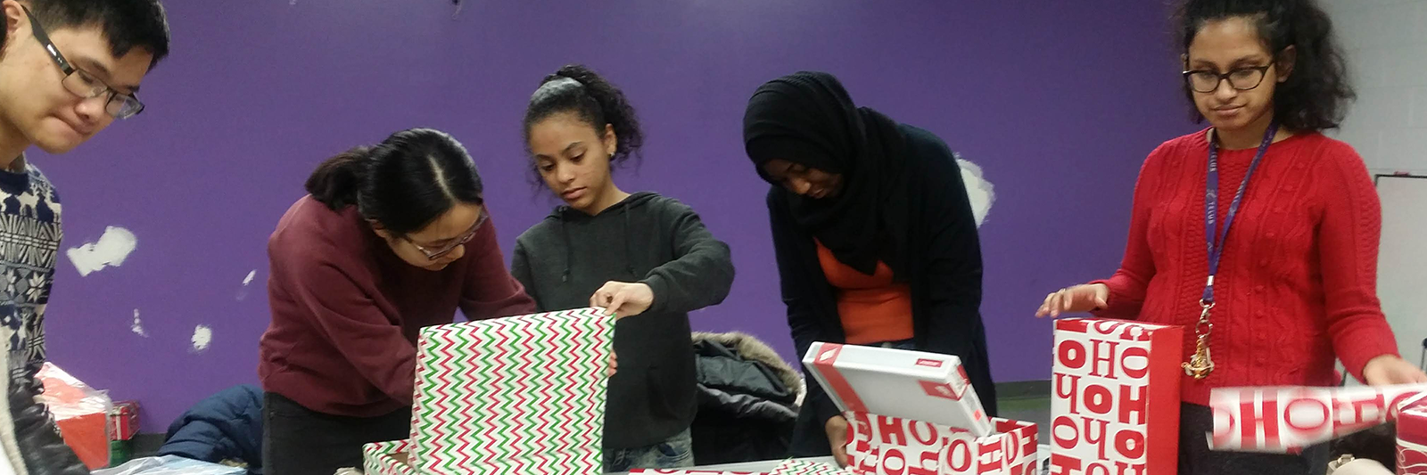 Students wrapping gifts