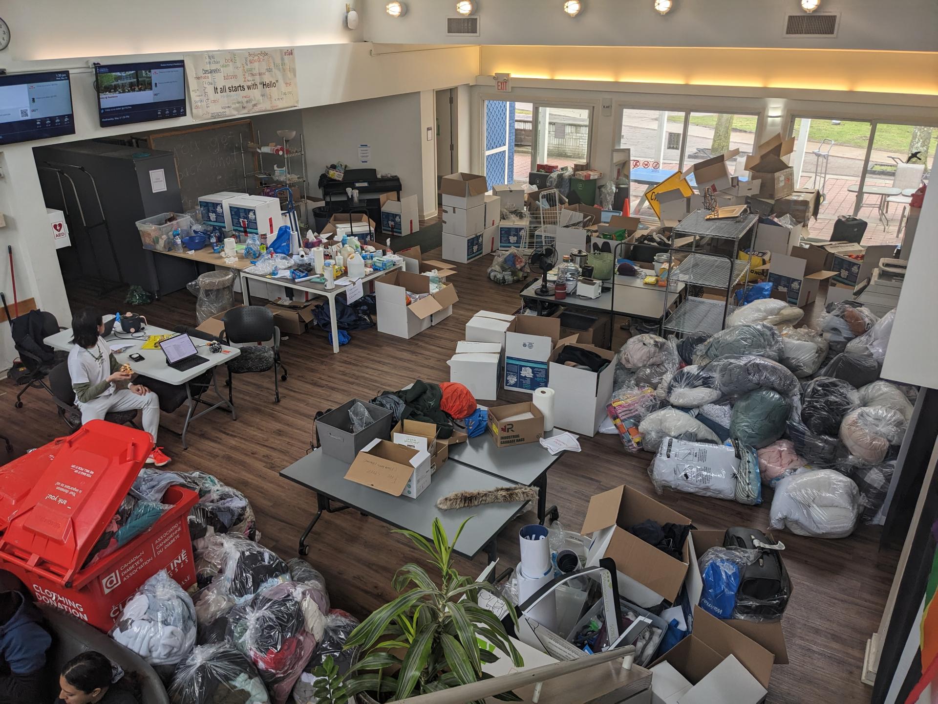 A wide shot of the Student Residence Centre full of donations